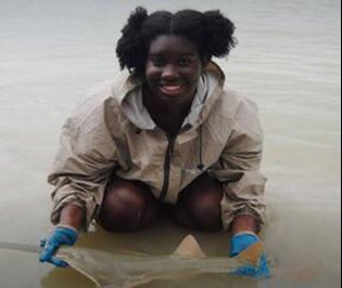 Jasmin Graham with a Smalltooth Sawfish